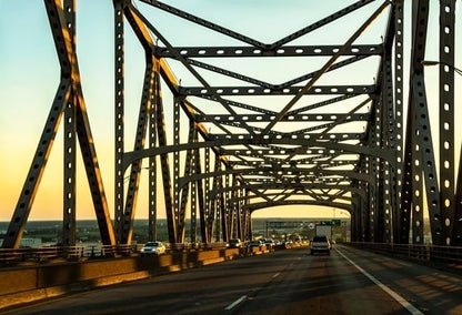 Car view on bridge going to West Baton Rouge, LA during sunset